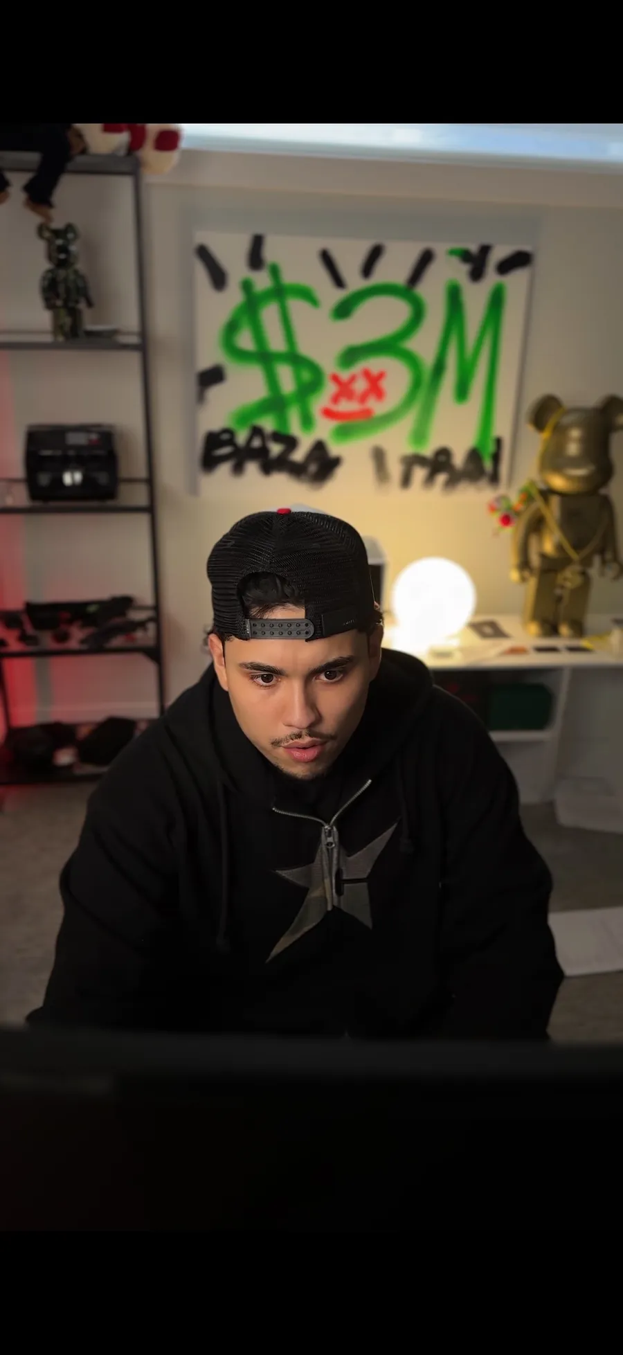 Raza at his desk during a live session